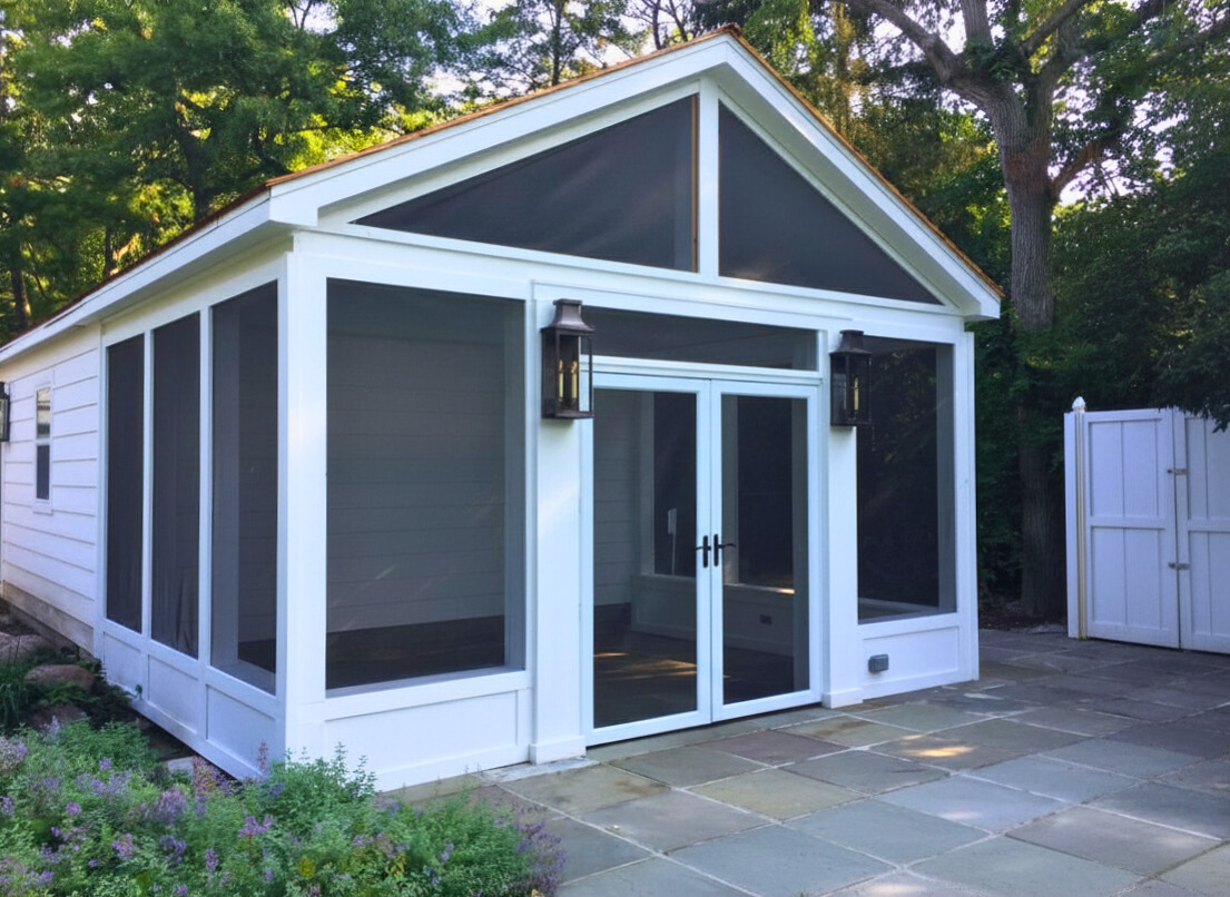 Screened porch patio enclosure with French doors and lanterns.
